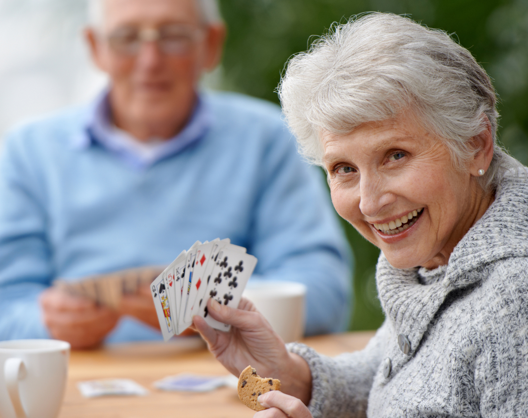 senior lady playing cards