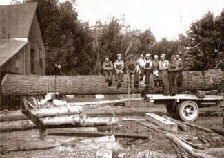 olf photo of men on log