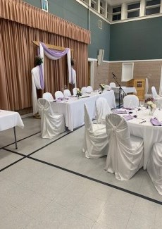 tables and chairs decorated for wedding