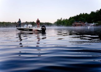 man in boat on lake