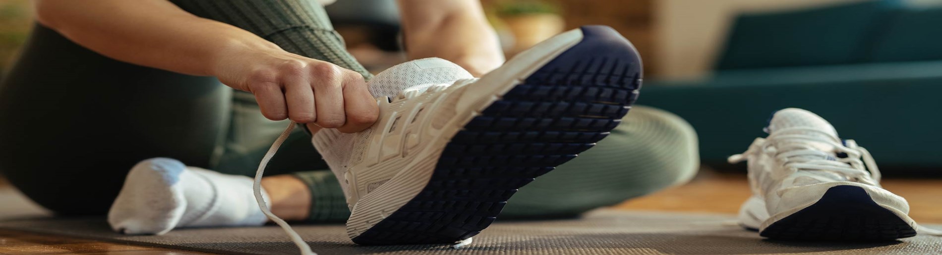 person putting on running shoes