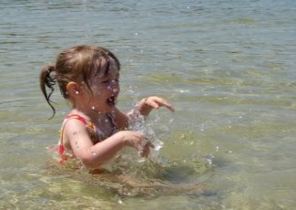 kids splashing in lake