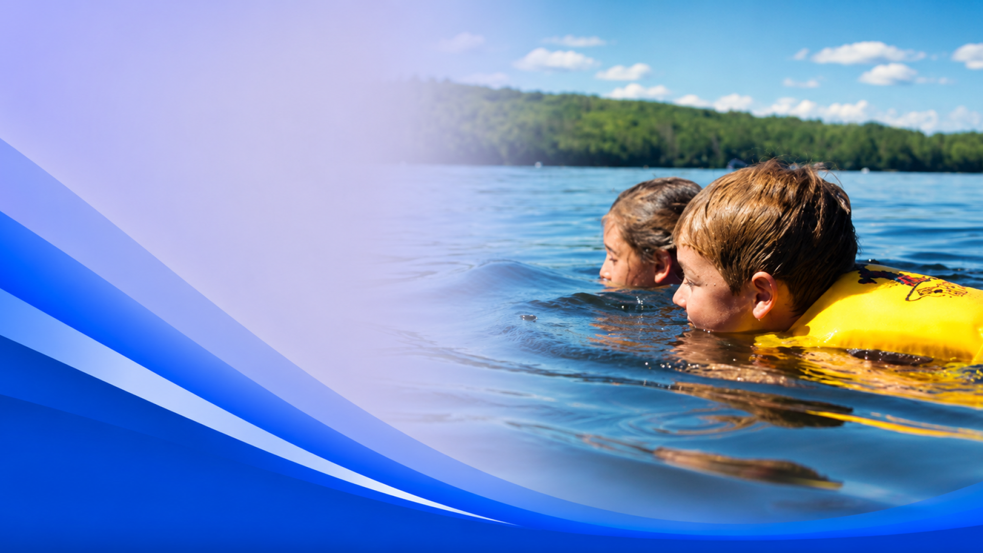 Children swimming in tranquil lakeside scene